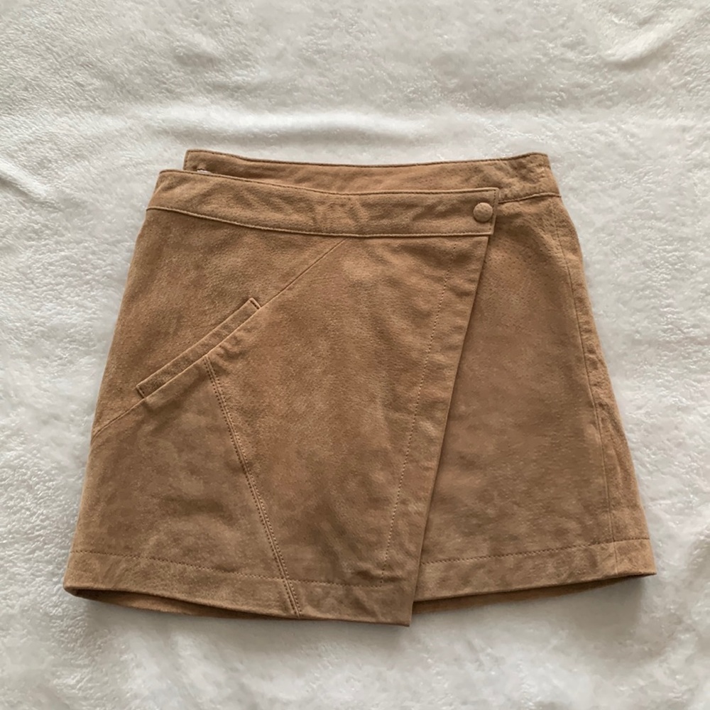 Brown leather mini skirt, wraps around the waist, size 26. Worn once!